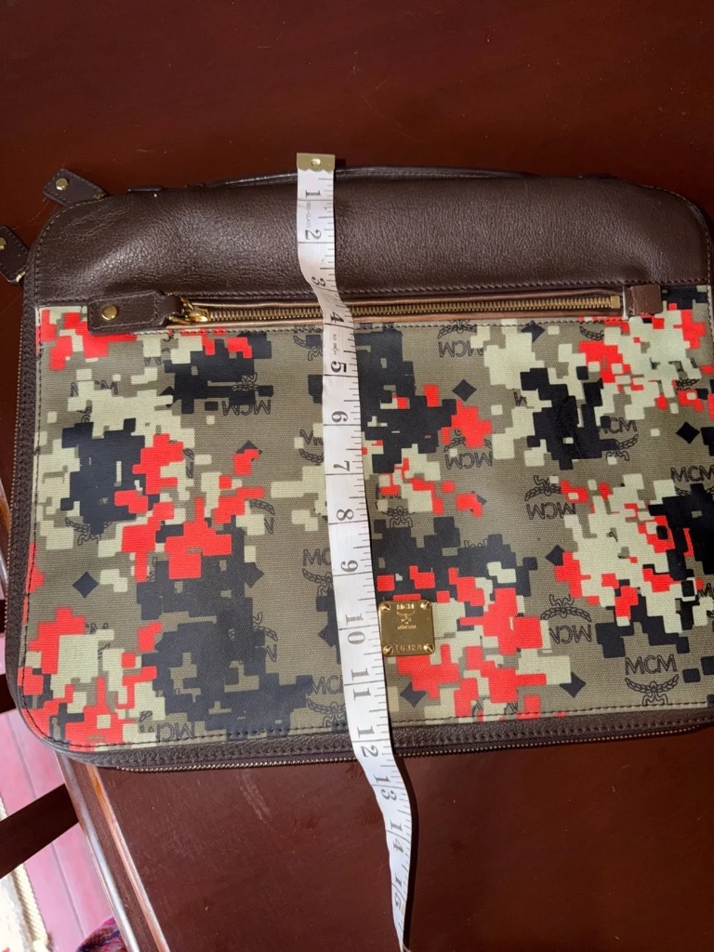 MCM laptop portfolio with brown leather trim and digital camo fabric